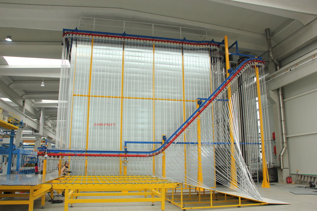 The photo shows the curing of the coating in combined vertical line ovens