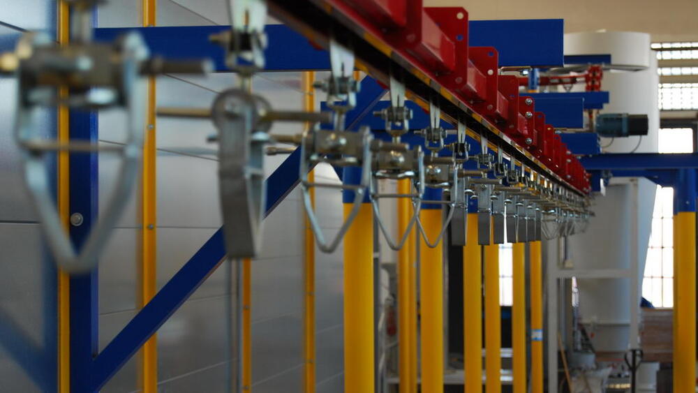 Photo of the conveyor and part hangers