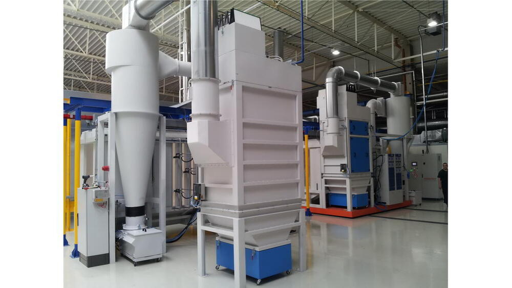 Photo of two sequential coating booths, one mounted on a mobile platform